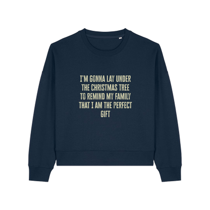 navy christmas sweater with the slogan 'i'm gonna lay under the christmas tree to remind my family that i am the perfect gift'