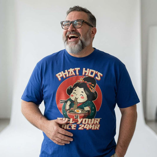 Bearded man with glasses laughing while wearing a blue Phat Ho’s Fill Your Face 24HR t-shirt, humorous mens Chinese takeaway graphic full of pure banter
