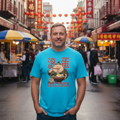 Man wearing a blue t-shirt with a graphic design on a street in an Asian market.