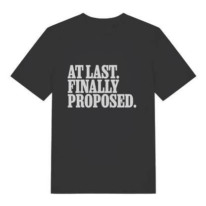Black At Last Finally Proposed funny slogan t-shirt with bold engagement text  