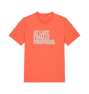orange matching t-shirt with the slogan 'at last finally proposed'