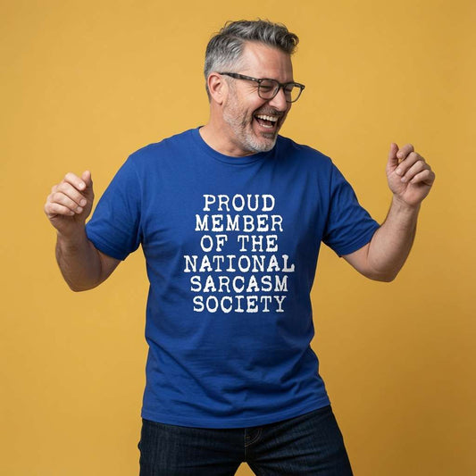 Man laughing with fists raised in a blue Proud Member of the National Sarcasm Society t-shirt, witty mens sarcastic personality text that every cynic will claim
