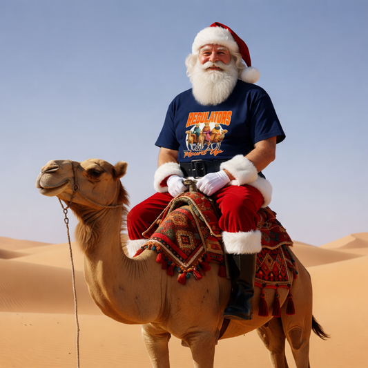 santa riding a camel in the desert wearing a navy coloured christmas t-shirt 