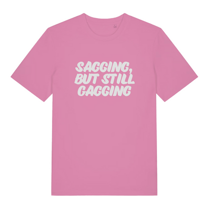 pink women's offensive t-shirt with the slogan 'sagging, but still gagging'