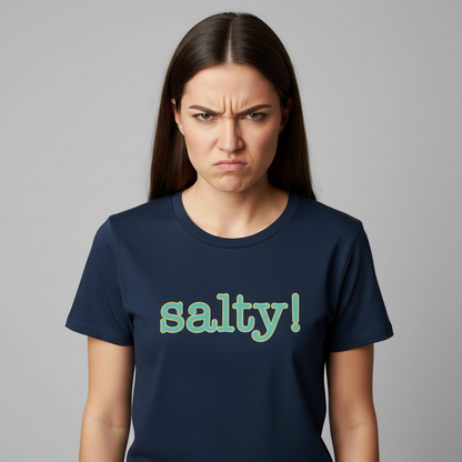 Woman wearing a navy blue t-shirt with 'salty!' text on a gray background