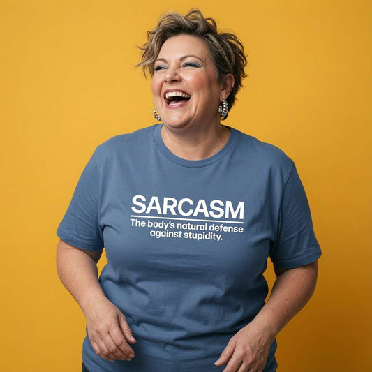 Woman laughing while wearing a blue Sarcasm t-shirt, humorous ladies witty sarcastic slogan design that every no-nonsense lady will claim