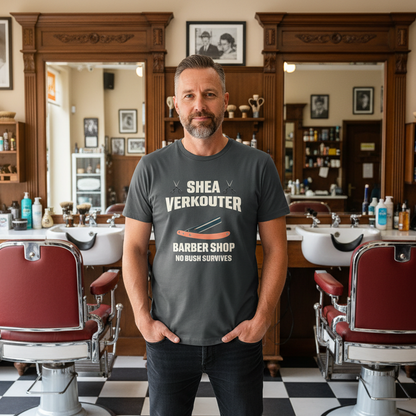 Man wearing a 'Shea Verkouter Barber Shop' t-shirt in a vintage barber shop setting.