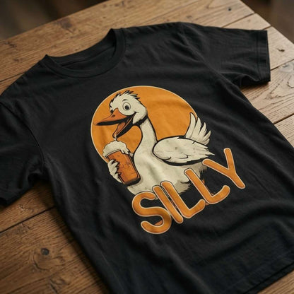 Black Silly Goose t-shirt laid flat on a wooden surface showing the complete goose and beer graphic, witty mens cheeky goose pub banter design that every drinking lad will claim