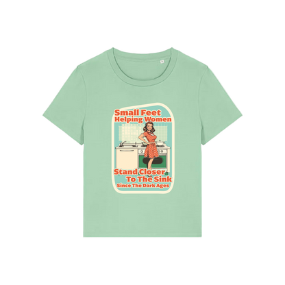 green funny offensive t-shirt with the graphic of a retro housewife and the slogan 'small feet helping women stand closer to the sink since the dark ages'