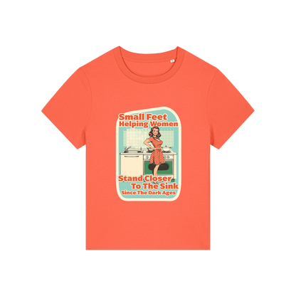 orange funny offensive t-shirt with the graphic of a retro housewife and the slogan 'small feet helping women stand closer to the sink since the dark ages'