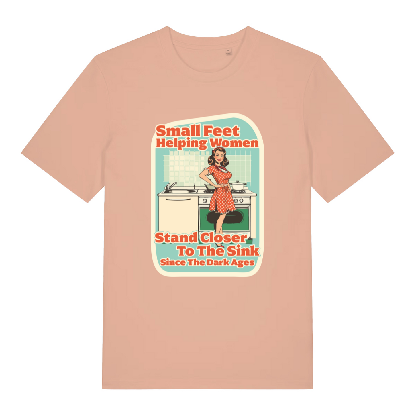 peach women's funny offensive t-shirt with the graphic of a retro housewife stood in a kitchen and the slogan 'small feet helping women stand closer to the sink since the dark ages'