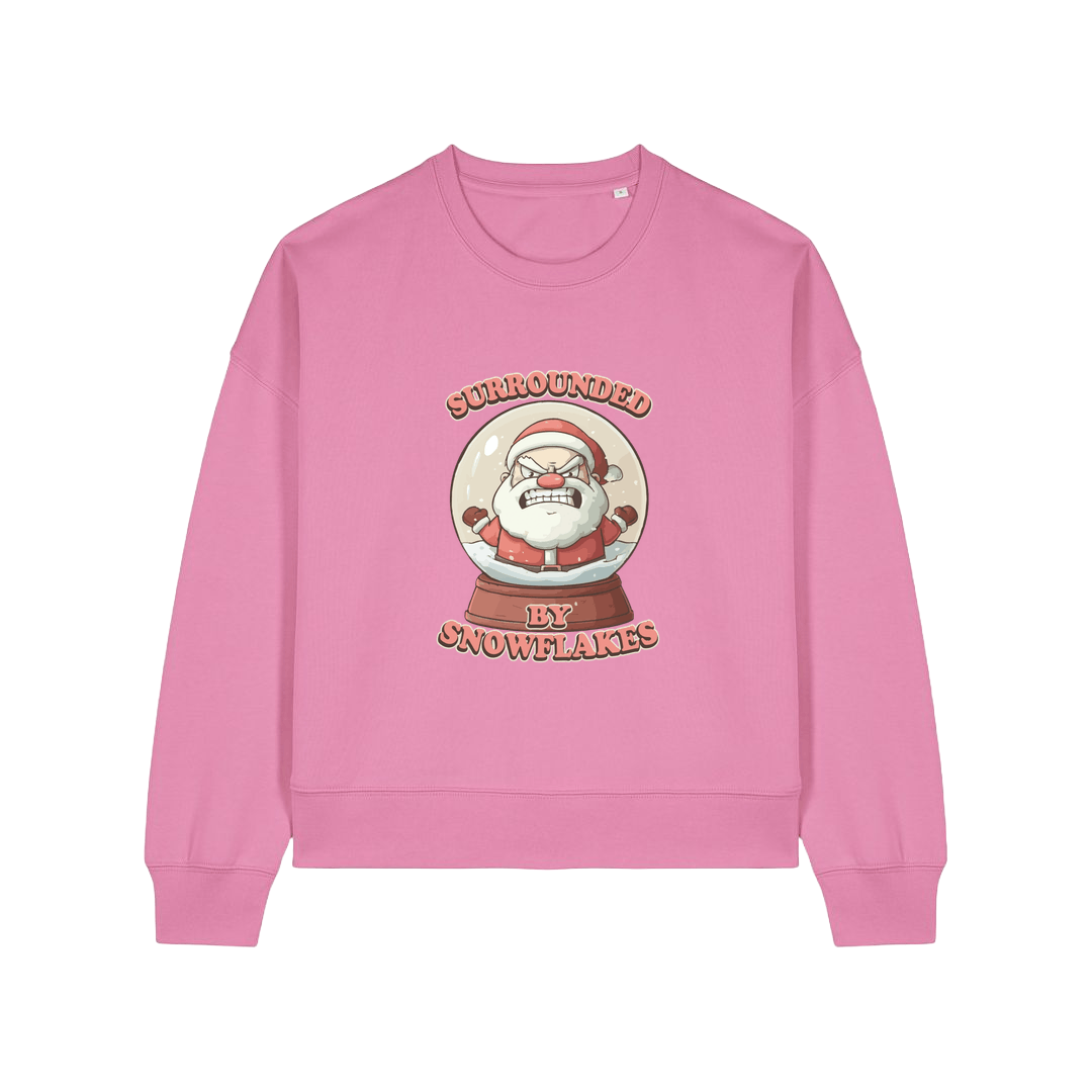 pink christmas sweater with the graphic of santa inside a snowglobe and the slogan 'surrounded by snowflakes'