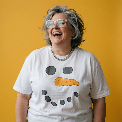 Woman laughing while wearing a white Snowman Face t-shirt, fun ladies festive design full of pure attitude