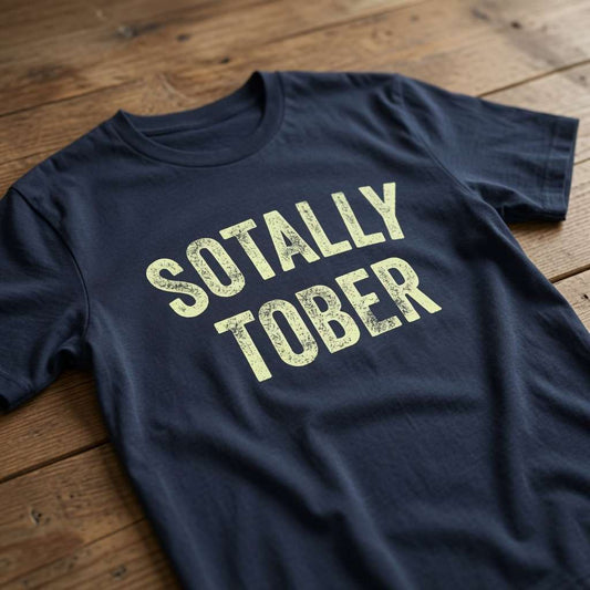 Navy Sotally Tober t-shirt laid flat on a wooden surface with distressed cream lettering, funny mens pub beer banter design