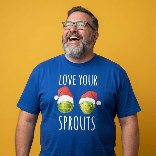 Bearded man with glasses laughing in a blue Love Your Sprouts t-shirt, humorous mens Christmas dinner sprout design that every festive lad will claim