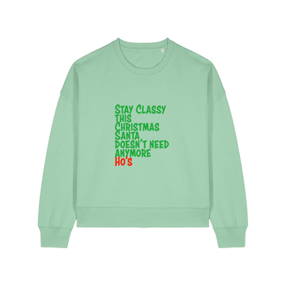 green christmas sweater with the slogan 'stay classy this christmas santa doesn't need anymore ho's'