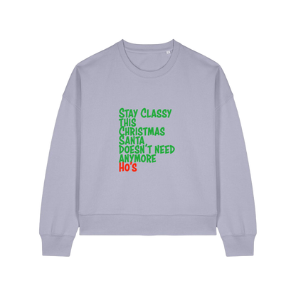 lavender christmas sweater with the slogan 'stay classy this christmas santa doesn't need anymore ho's'