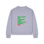 lavender christmas sweater with the slogan 'stay classy this christmas santa doesn't need anymore ho's'