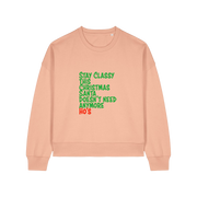 peach christmas sweater with the slogan 'stay classy this christmas santa doesn't need anymore ho's'