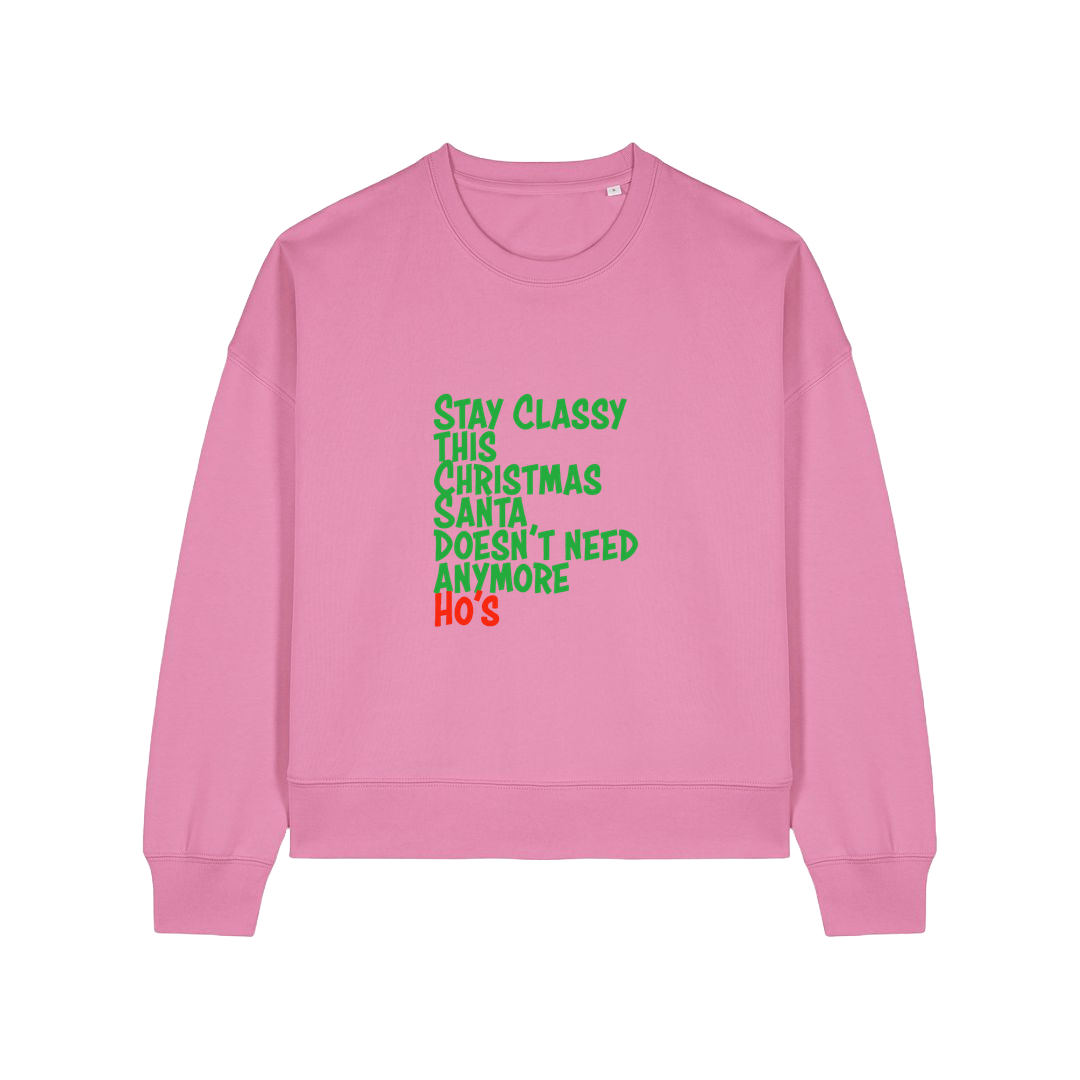 pink christmas sweater with the slogan 'stay classy this christmas santa doesn't need anymore ho's'