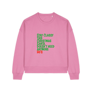pink christmas sweater with the slogan 'stay classy this christmas santa doesn't need anymore ho's'