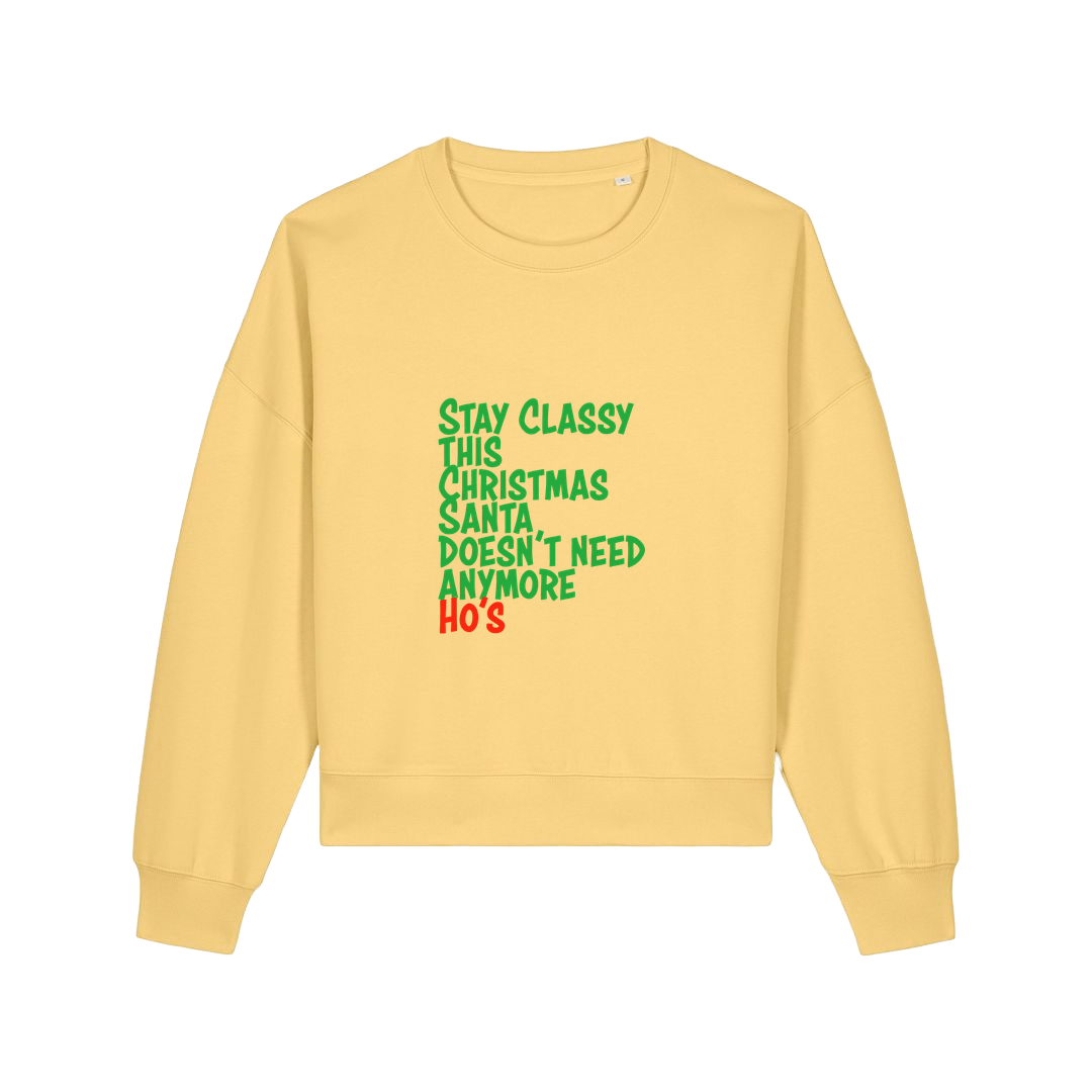 yellow christmas sweater with the slogan 'stay classy this christmas santa doesn't need anymore ho's'