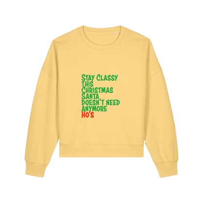 yellow christmas sweater with the slogan 'stay classy this christmas santa doesn't need anymore ho's'