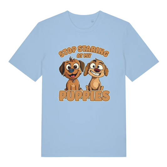 light blue women's funny animal t-shirt with the graphic of two puppies and the slogan 'stop staring at my puppies'