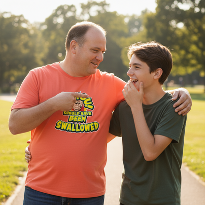 Man and boy standing together on a path with trees in the background