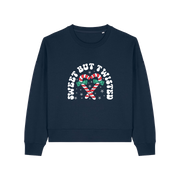 navy christmas sweater with the graphic of candy canes and the slogan 'sweet but twisted'
