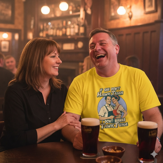 man wearing a yellow t-shirt with a funny graphic, sat with a lady in a pub setting