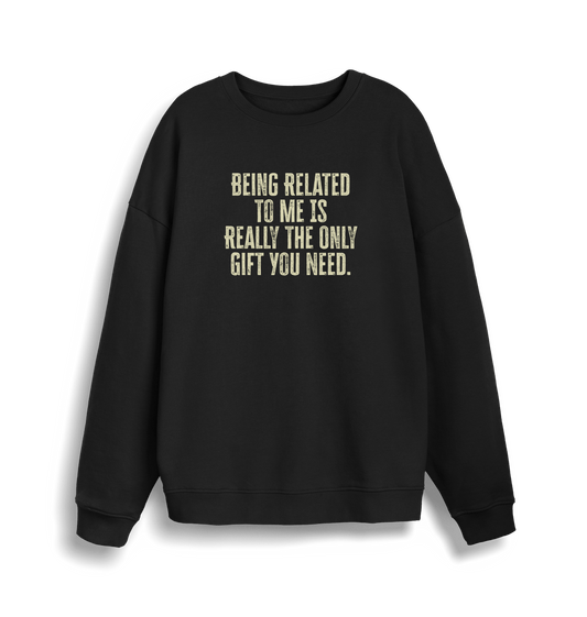back christmas jumper with the slogan 'being related to me is really the only gift you need'