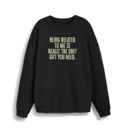 back christmas jumper with the slogan 'being related to me is really the only gift you need'