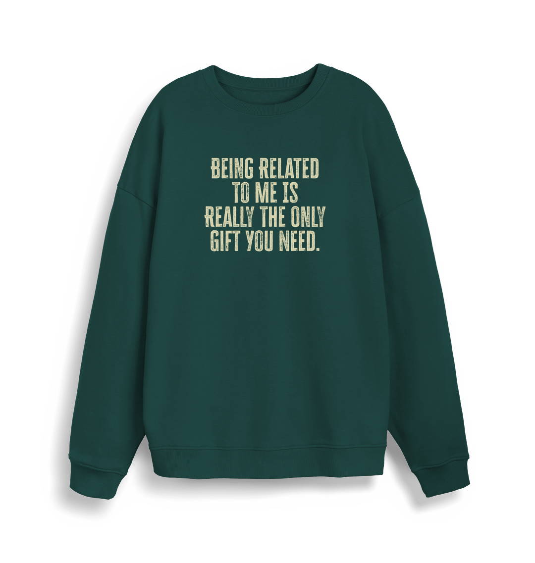 green christmas jumper with the slogan 'being related to me is really the only gift you need'