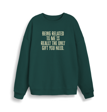 green christmas jumper with the slogan 'being related to me is really the only gift you need'