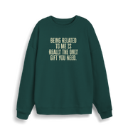 green christmas jumper with the slogan 'being related to me is really the only gift you need'
