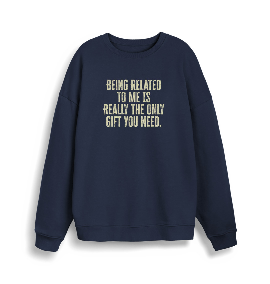 navy christmas jumper with the slogan 'being related to me is really the only gift you need'