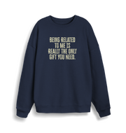 navy christmas jumper with the slogan 'being related to me is really the only gift you need'