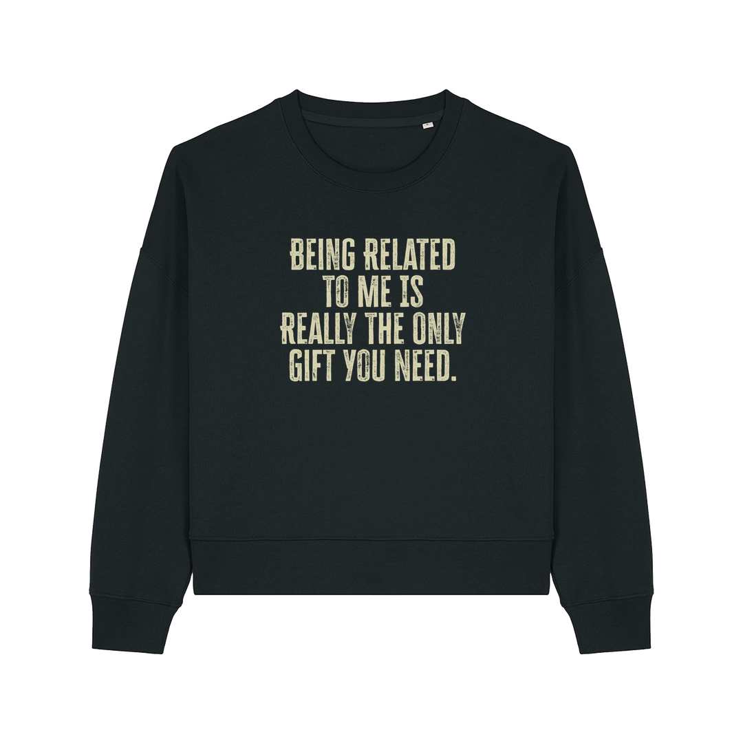black christmas sweater with the slogan 'being related to me is really the only gift you need'