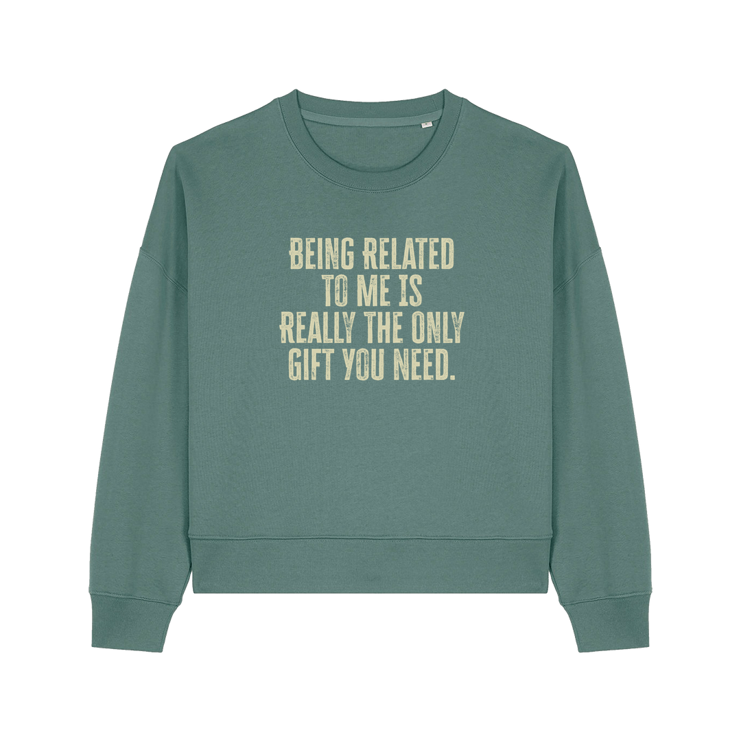 green christmas sweater with the slogan 'being related to me is really the only gift you need'