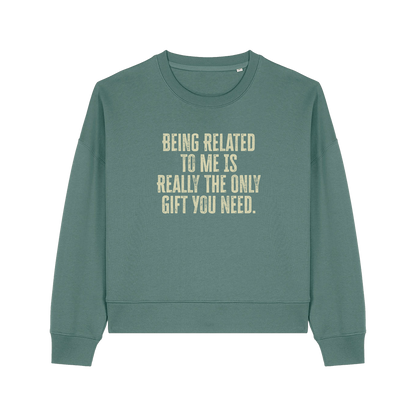 green christmas sweater with the slogan 'being related to me is really the only gift you need'