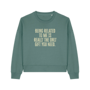 green christmas sweater with the slogan 'being related to me is really the only gift you need'
