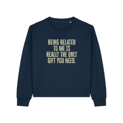 navy christmas sweater with the slogan 'being related to me is really the only gift you need'