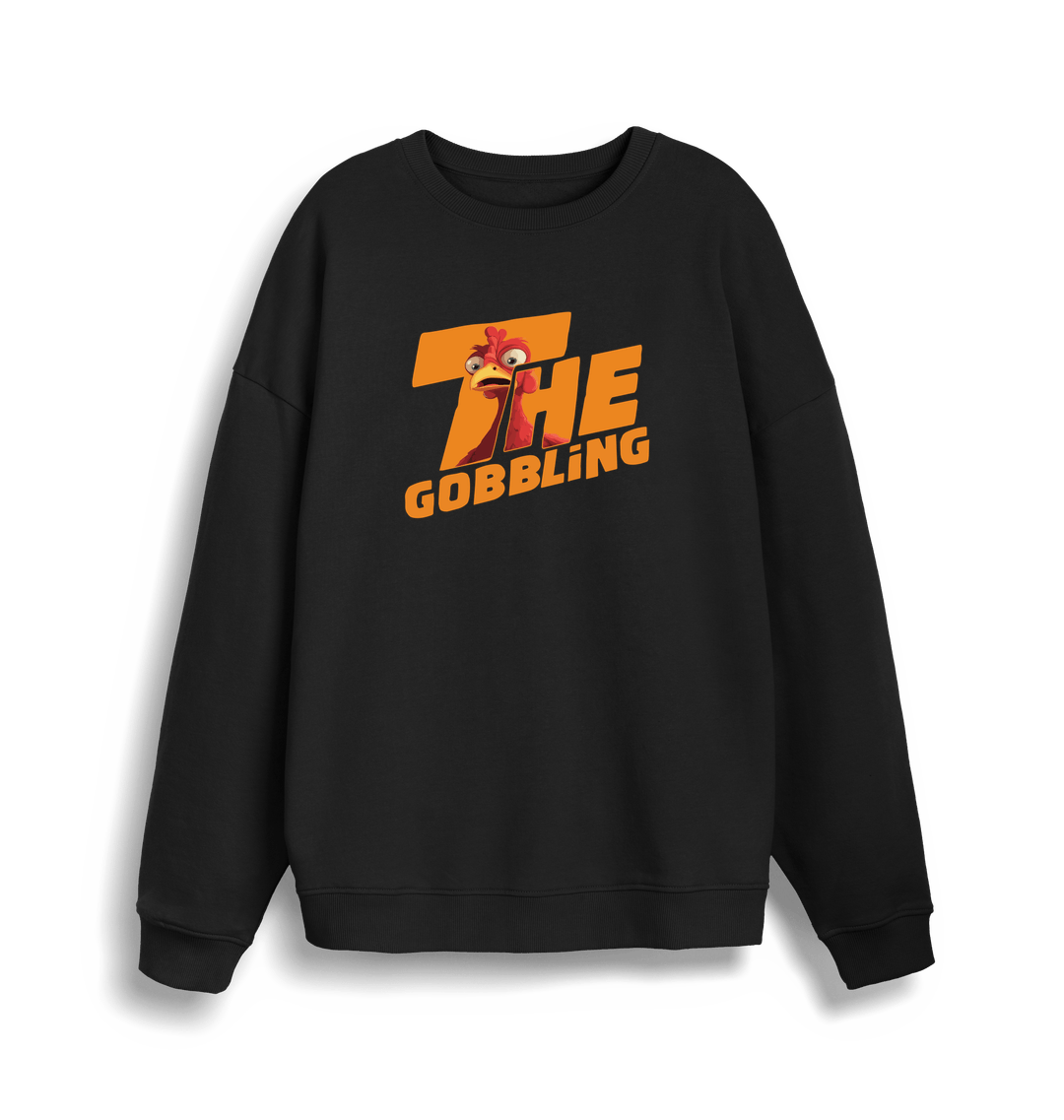 black christmas sweater with the slogan 'the gobbling'