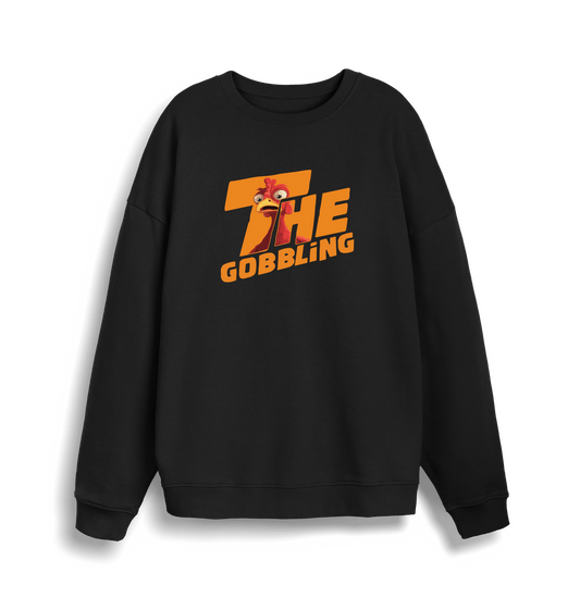 black christmas sweater with the slogan 'the gobbling'