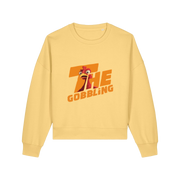yellow christmas sweater with the slogan 'the gobbling' and the graphic of a turkey inside the writing