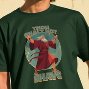 Green funny beard t-shirt with a graphic design of a moses in a robe and text 'Thou Shalt Not Shave' on a beige background.