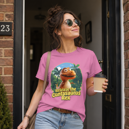 Woman wearing a pink t-shirt with a dinosaur graphic and text, standing outside a building.