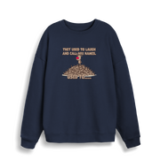 navy christmas sweater with the graphic of rudolph stood on top of a pile of reindeer and the slogan 'they used to laugh and call him names used to... '