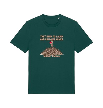 green christmas t-shirt with the graphic of rudolph stood on tp of a pile of reindeer and the slogan 'they used to call him names used to...'